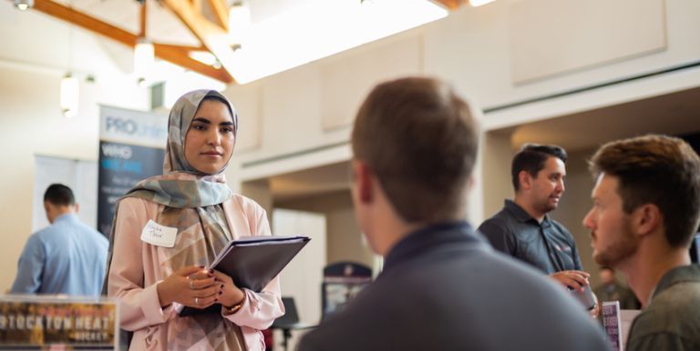 student talking to employer