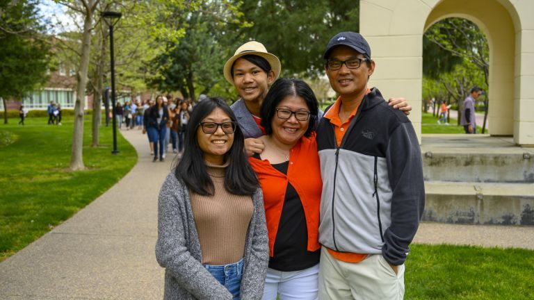 Student on campus with family