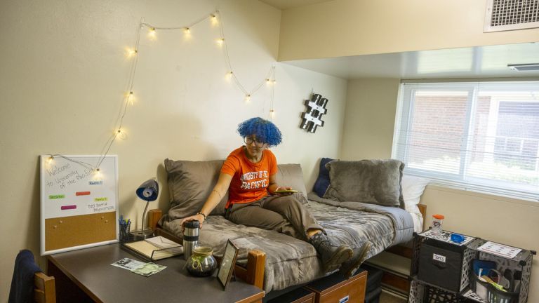student in dorm room