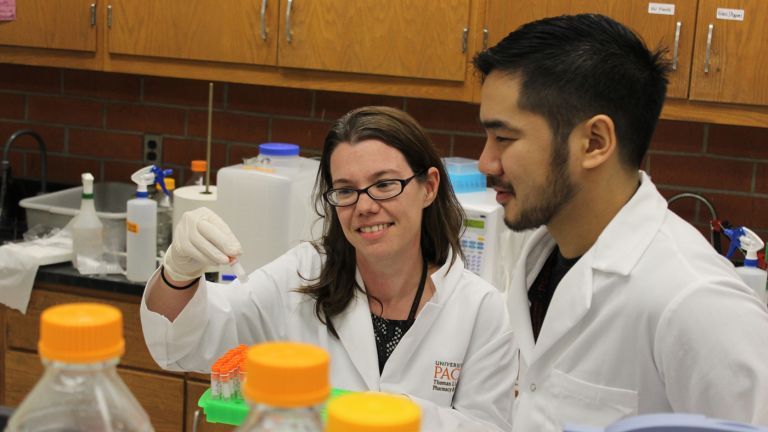 pharmacy faculty with student in lab