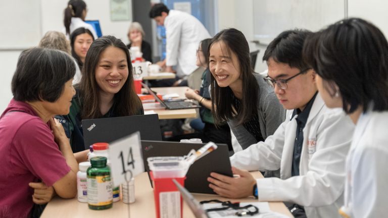 PharmD students with patients at a health care outreach clinic