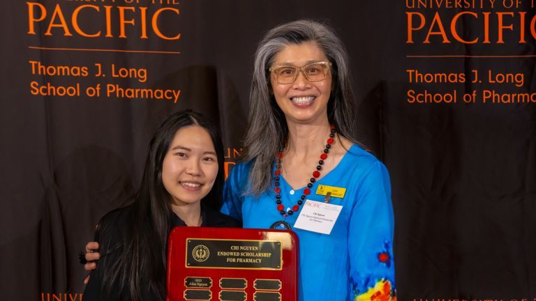 Alumni donor Chi Nguyen with PharmD student scholarship recipient