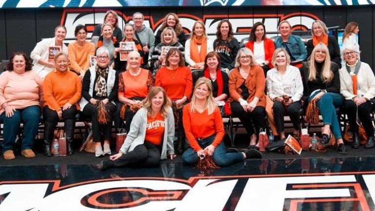 First Lady Jean Callahan (front row, right) with other women leaders from the campus and community at a women's basketball game