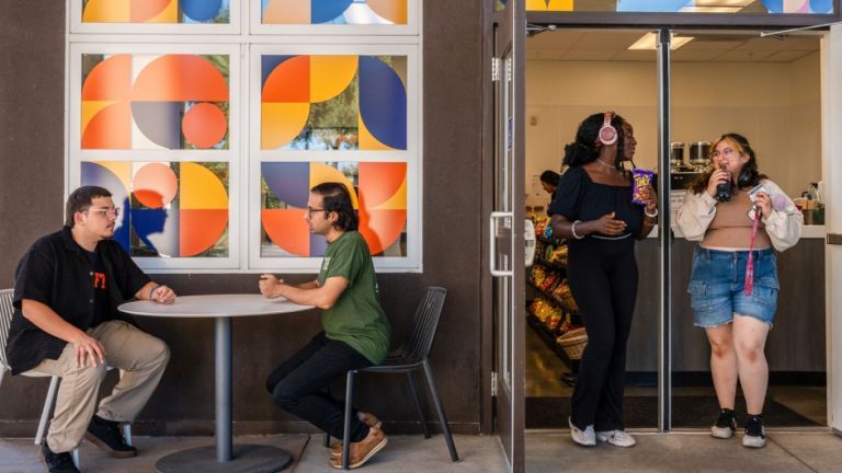 students walk out of the new Cafe 1851