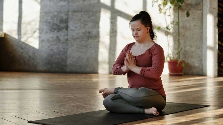 woman with Down syndrome doing yoga