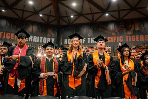 A group of graduates stand together