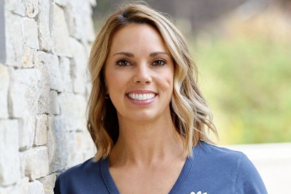 Photo shows smiling face of Kim Howard-Colón
