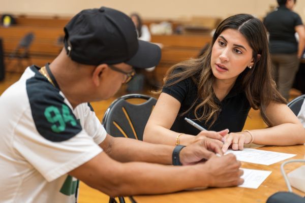 PharmD student with patient at health care outreach clinic