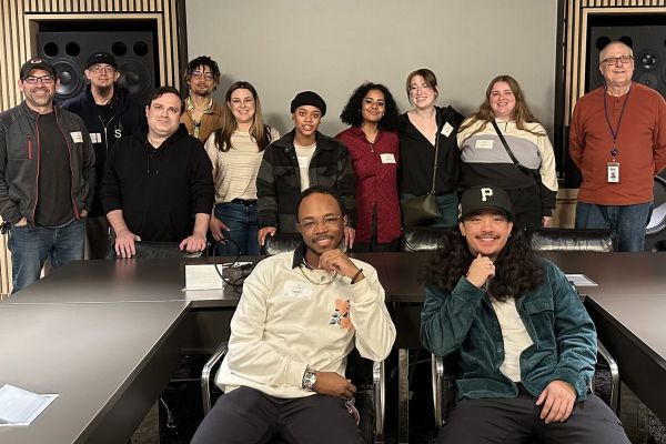 Pacific music industry study students at a music studio