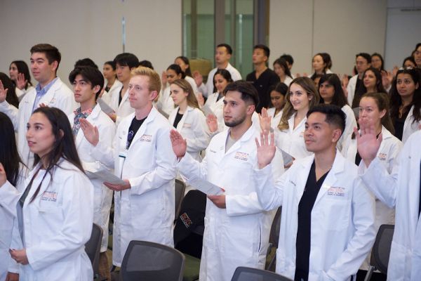 students taking researcher oath