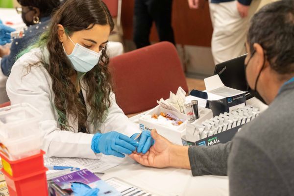 Student with patient at Diabetes Care Clinic