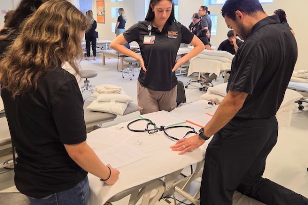 A group of four students is working together on an IPE exercise.