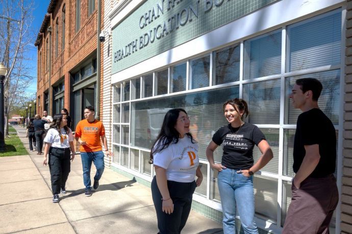 OT students talking on the sidewalk