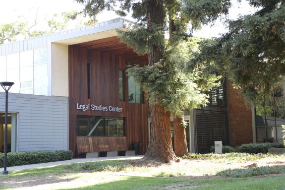 A landscape of a building that is titled "Legal Studies Center"
