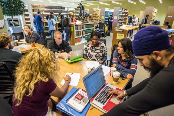 A group of law students sits at a table.