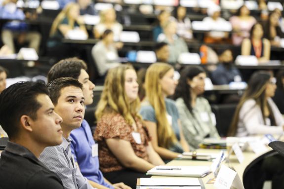 A group of law students sits in a lecture hall.