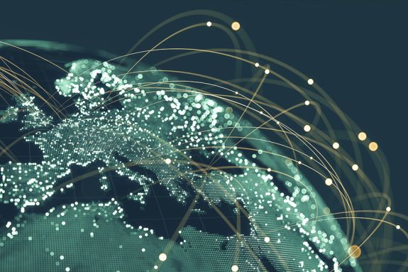 Blue globe viewing from space at night with connections between cities.