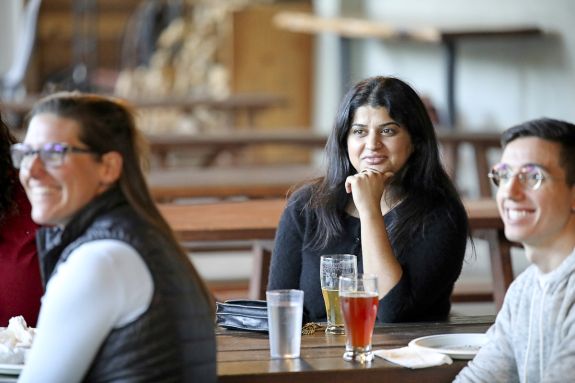 A group of law students sits at an off-campus restaurant.