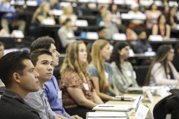 A group of law students sits in a lecture hall.
