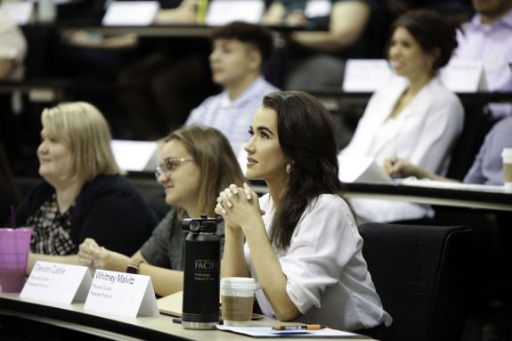 A group of law students sits in a classroom.