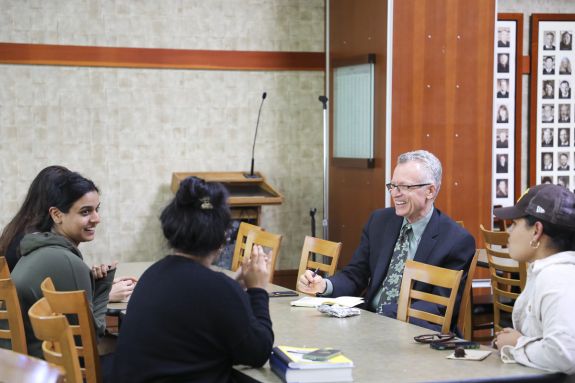 students talking with the dean 