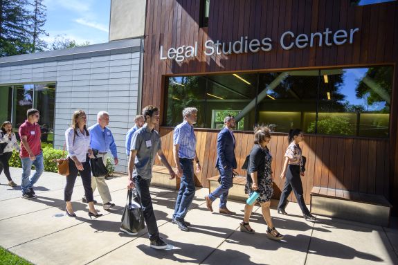 A group of students walk into the library