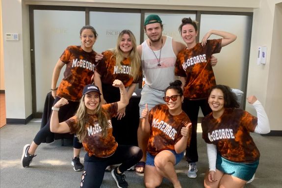 A group of students in matching tie-dye shirts