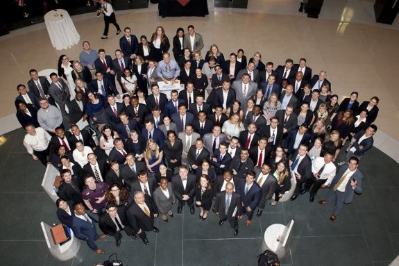 A large group of people pose for a photo at an event