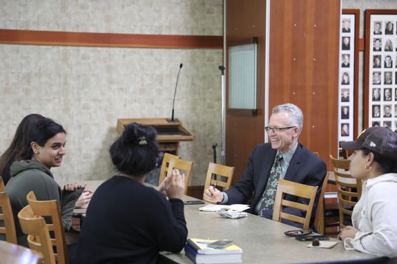 Dean talks with students 