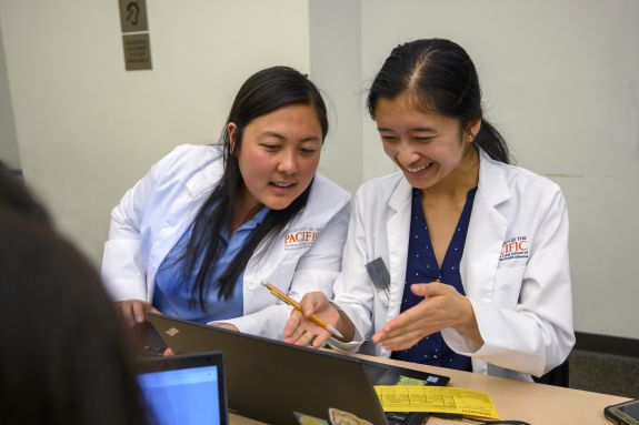 Two students collaborating in class