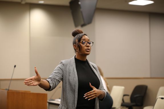 A law student speaks to a pretend jury.