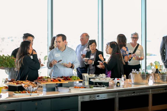 Alumni talking with each other 