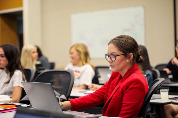 A law student sits in a classroom.