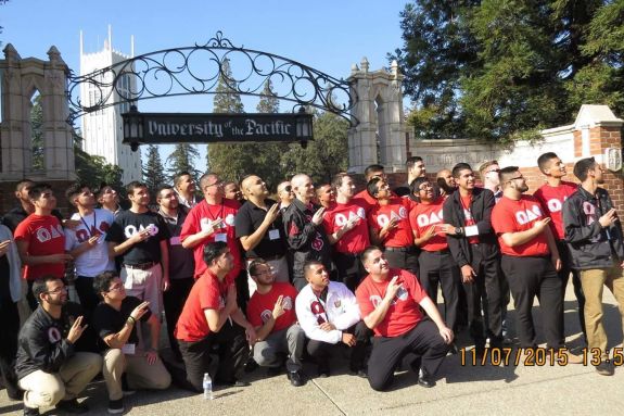 Omega Delta Phi members posing outside Pacific's gate