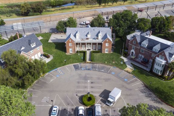 Three greek houses and parking lot