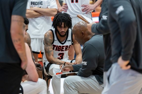 Men's Basketball team in timeout