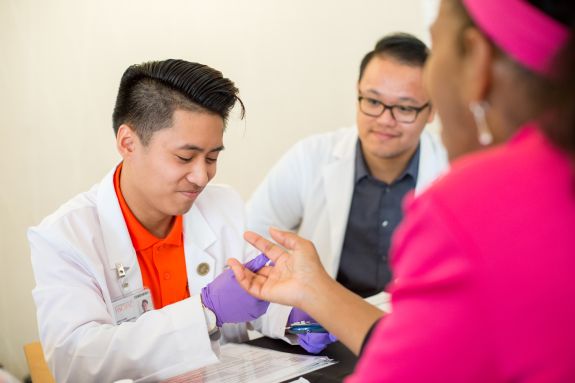 PharmD student with patient