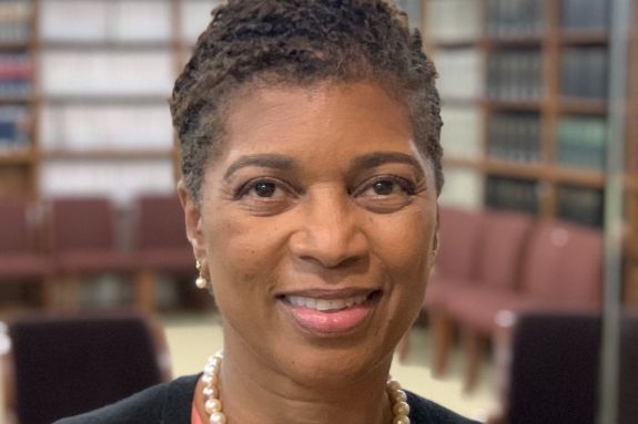 A portrait of a woman in a library