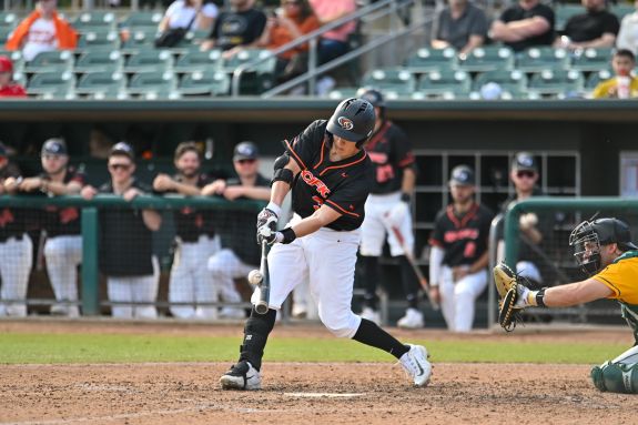 Pacific baseball player hits the ball.