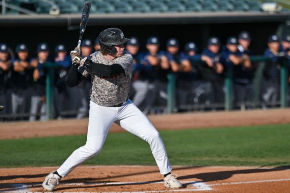 Pacific baseball player hits the ball.