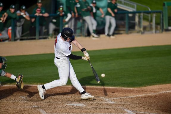 Pacific baseball player hits the ball.