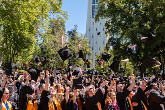 Students tossing their caps