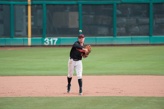 Pacific baseball player throws the ball.