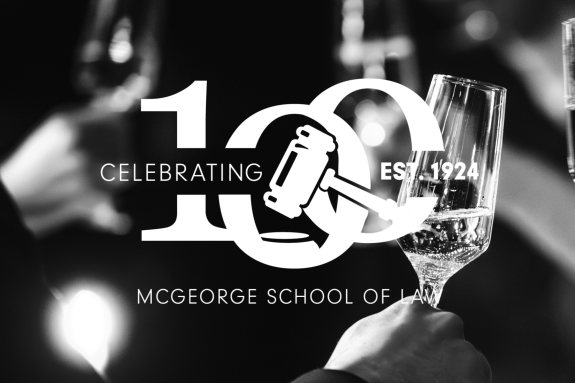 100 year logo with raised glasses in the background