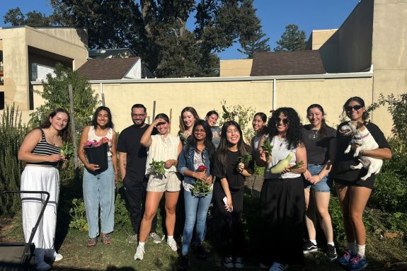 Nutrition students in front of wall to be painted
