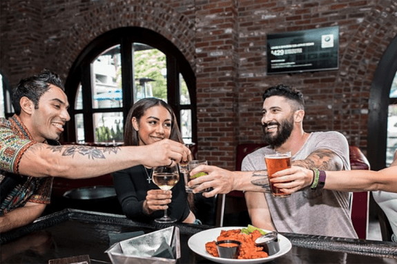 Guests at 207 offer a toast.