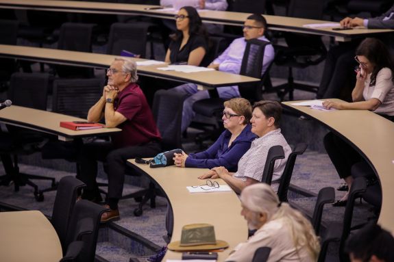 Audience listening intently.