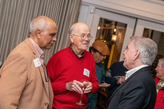 emeriti speaking with president callahan at the presidents residence