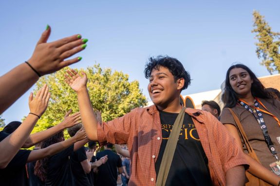 students high fiving