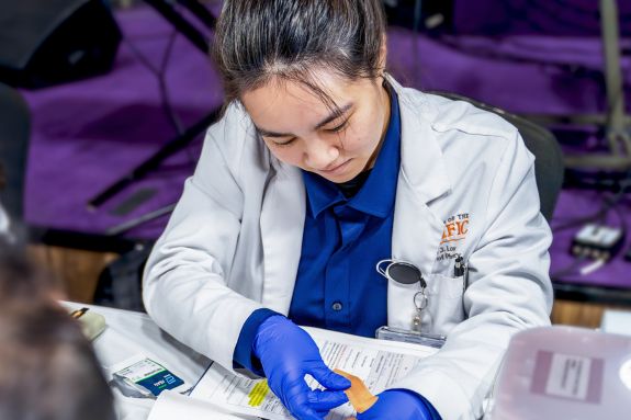 PharmD studnet with patient at clinic